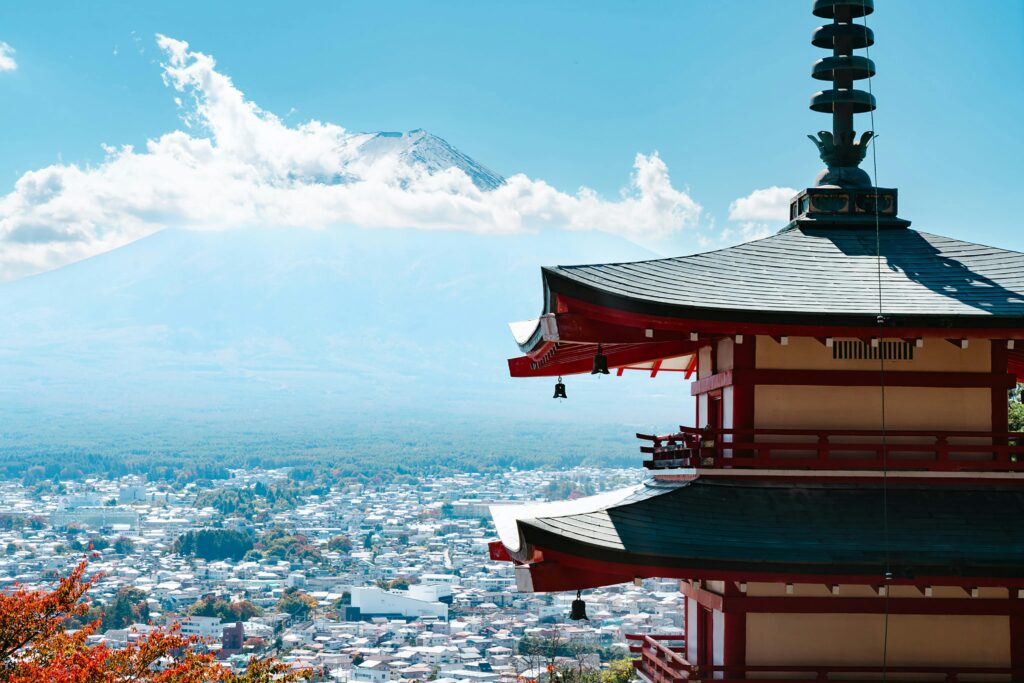 Pagoda with a backdrop of a cloudy blue sky and mountain